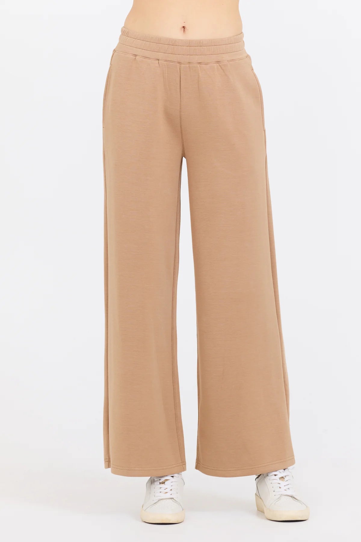 The Caramel Cloud Fleece Flare Pant boasts a blend of Cloud Fleece fabric made from 49% Modal, 45% Polyester, and 6% Spandex for the perfect combination of comfort and stretch.