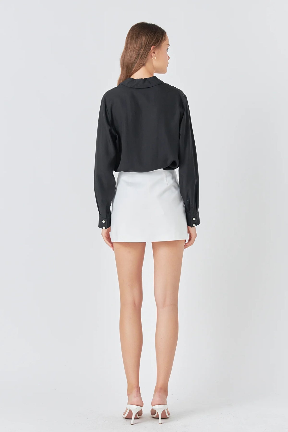 Discover the perfect balance of comfort and style with our trendy Pearl Button Collared Shirt. Made with soft and durable Poplin fabric, this long sleeve shirt offers a relaxed fit that hugs your body in all the right places. The V neckline adds a touch of elegance and enhances your silhouette, making it a versatile piece for any occasion. With its neutral pearl buttons, this shirt exudes charm and grace. Shop now and elevate your wardrobe with this must-have essential.
Don't forget to hand wash cold and a