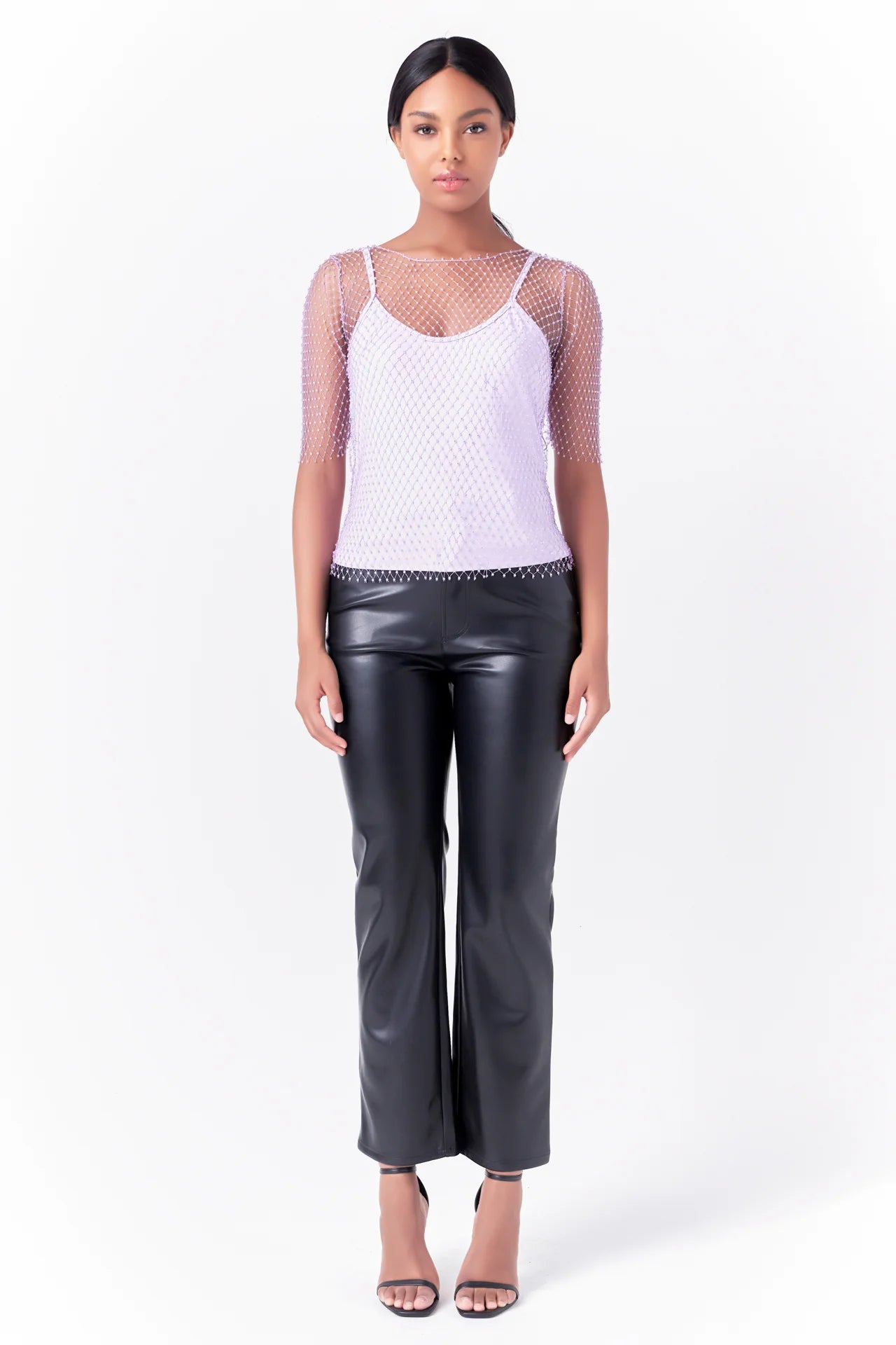 Crafted from mesh fabric, this Embellishment Short Sleeve Top adds a touch of sophistication to any outfit. With its dazzling embellishments and square neckline, it can be worn as a sleeveless cami top and paired with jeans, skirts, or even shorts for a modern and stylish look. This versatile top is the perfect addition to your wardrobe and can be hand washed with cold water.
It is made of 100% polyester shell and lining, and should not be bleached or tumbled dry. Keep your wardrobe looking fresh and fashi