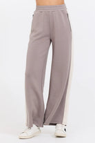 This Taupe/South Beach Sand Colorblock Cloud Fleece Pant features a bold stripe down the side, providing a unique touch to your daily casual attire. It is expertly made with a blend of 49% Modal, 45% Polyester, and 6% Spandex for ultimate comfort and style.