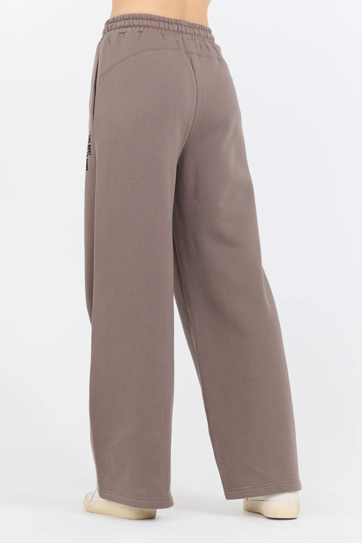 Constructed from a 49% Modal, 45% Polyester, and 6% Spandex blend, the Taupe Grey Fleece Pants with Flocking Detail offer a perfect combination of comfort and style.