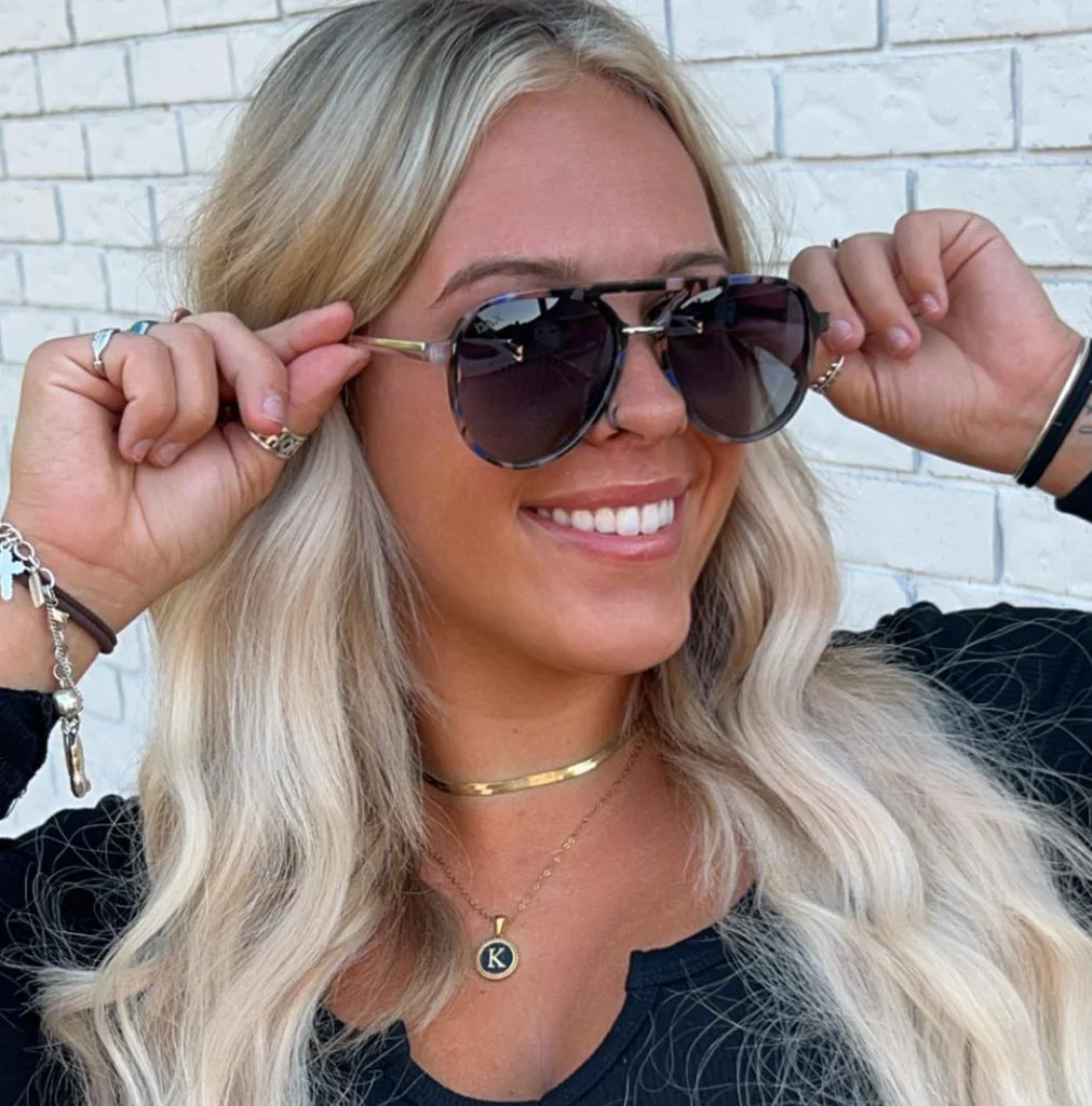 Get rid of heavy shades and hair damage by choosing Earhart! These polarized sunglasses are lightweight and hair-friendly.

&nbsp;Every pair of glasses comes in a DAX Eyewear box with a storage pouch and cleaning wipe.

Specs: Frame Size: Medium-Large, Frame Material: Acrylic-Metal, Polarized: Yes, UV Protection: Yes, Lens width: 54 millimeters.