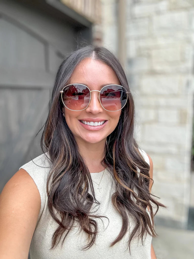 Georgie boasts a beautiful gold frame and a perfectly shaped lens, making it a great choice for anyone.

Each pair comes in a DAX Eyewear box with a storage pouch and cleaning wipe.

Specs include: Frame Size - Medium/Large, Frame - Metal, Polarized - No, UV Protection Coating - Yes, Lens width - 61mm, Lens height - 55mm, Bridge - 21mm, Frame length - 150mm.