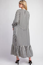 This Striped Long Sleeve Maxi Kimono boasts an open front design with smocked shoulders and cuffs, as well as belt loops and a tie waist closure. Made with a flowy fabrication, it is constructed with 100% polyester for a comfortable and stylish fit.