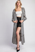 This Striped Long Sleeve Maxi Kimono boasts an open front design with smocked shoulders and cuffs, as well as belt loops and a tie waist closure. Made with a flowy fabrication, it is constructed with 100% polyester for a comfortable and stylish fit.