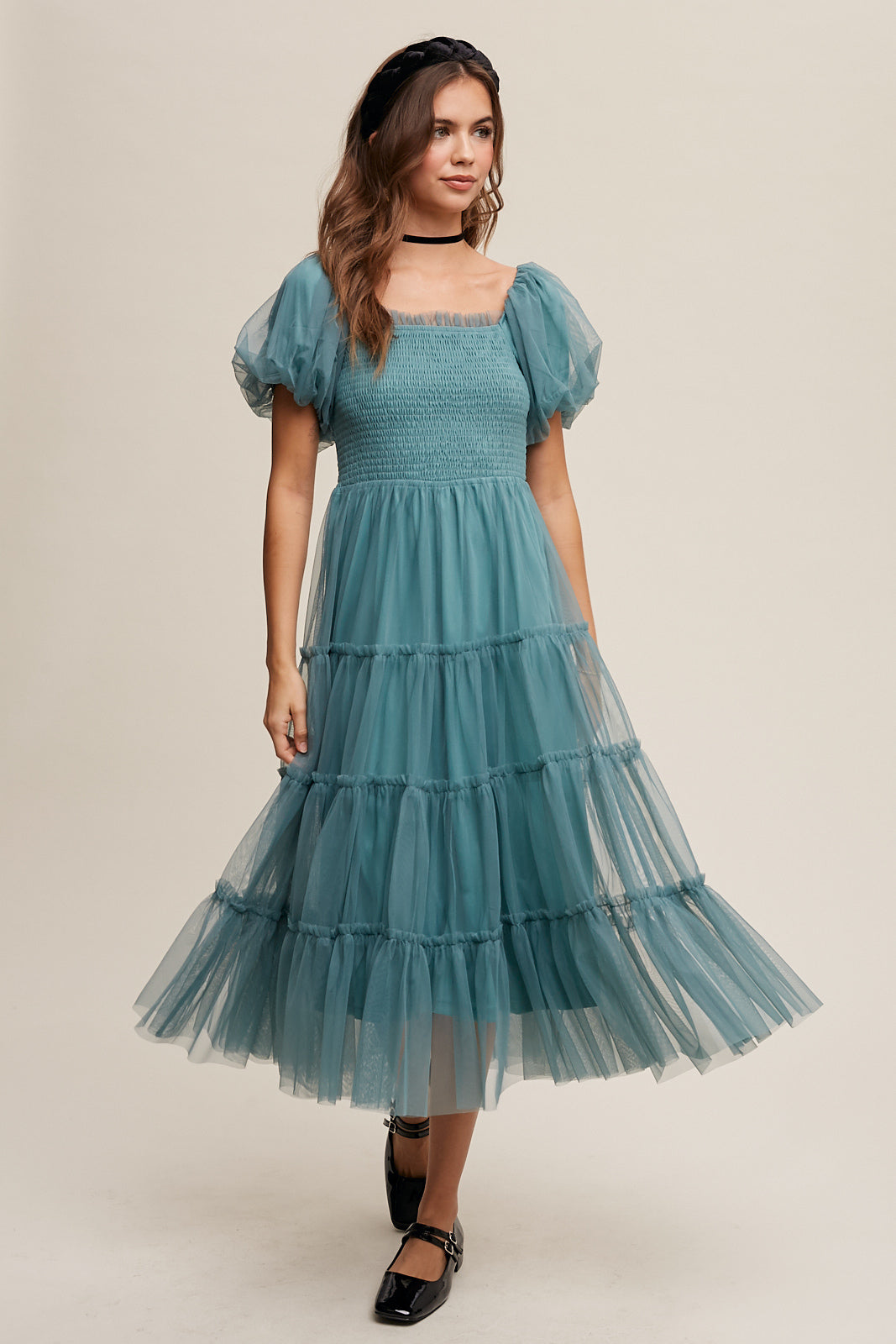 This Sagebrush colored Puff Sleeve Smocked Mesh Maxi Dress features a square neck, ruffle detail, and elastic for a comfortable and stylish fit. The smocked bodice and puff sleeves add texture and dimension, while the tiered skirt and raw edge provide a unique finish. Made of 100% Polyester, this dress is fully lined for ultimate comfort and quality.