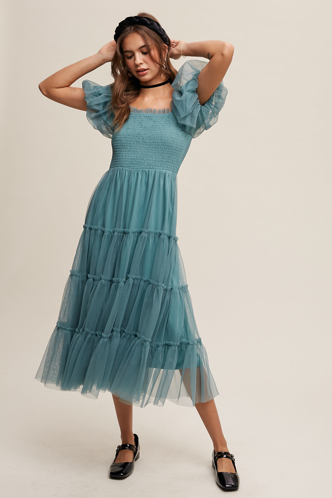 This Sagebrush colored Puff Sleeve Smocked Mesh Maxi Dress features a square neck, ruffle detail, and elastic for a comfortable and stylish fit. The smocked bodice and puff sleeves add texture and dimension, while the tiered skirt and raw edge provide a unique finish. Made of 100% Polyester, this dress is fully lined for ultimate comfort and quality.