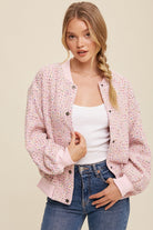 This bomber jacket is crafted with tweed and adorned with sparkling sequins. The center front features snap buttons, while the neck, cuffs, and hem are ribbed. It also has long sleeves and front pockets. The entire jacket is lined with 100% polyester, making it a stylish and comfortable choice.