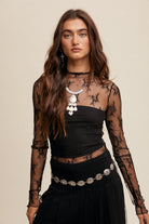 This Lace Mock Neck Long Sleeve Layering Top features a light weight sheer fabrication with mesh embroidery, offering a sophisticated and elegant look. The top also includes a mock neck and long sleeves, and is made with 90% Nylon and 10% Spandex for a comfortable and stretchy fit. It is available in black.