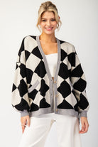 This Checkered Print Sweater Cardigan showcases a button down front, dropped shoulders, two open front pockets, banded cuffs, bubble sleeves, and a high-low design. Crafted with a blend of 50% Viscose, 30% Polyester, and 20% Nylon, it boasts an oversized silhouette for a fashionable look.