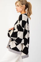 This Checkered Print Sweater Cardigan showcases a button down front, dropped shoulders, two open front pockets, banded cuffs, bubble sleeves, and a high-low design. Crafted with a blend of 50% Viscose, 30% Polyester, and 20% Nylon, it boasts an oversized silhouette for a fashionable look.